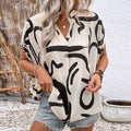 Elegante Damenbluse mit geometrischem Druck und V-Ausschnitt