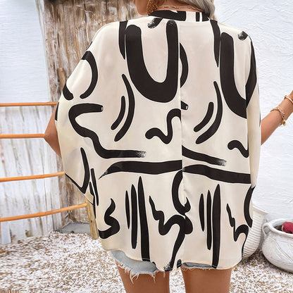 Elegante Damenbluse mit geometrischem Druck und V-Ausschnitt