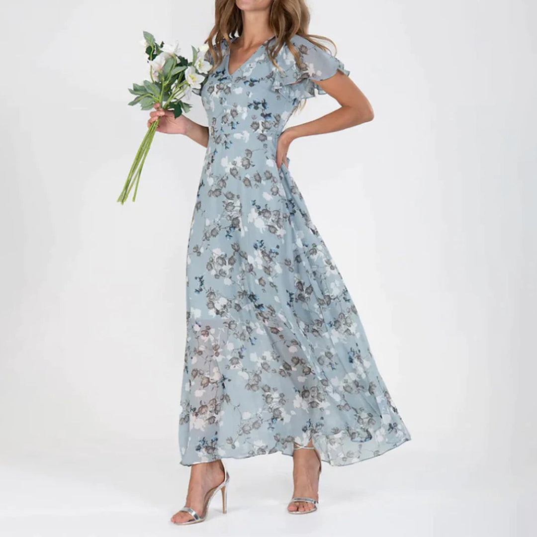 V-Ausschnitt und elegantes, modern geschnittenes, geblümtes Maxikleid