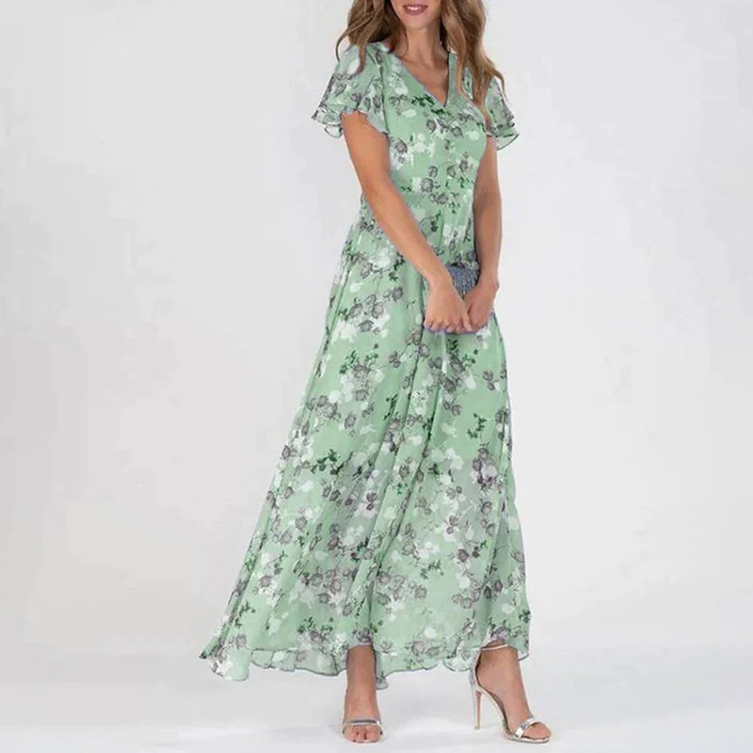 V-Ausschnitt und elegantes, modern geschnittenes, geblümtes Maxikleid